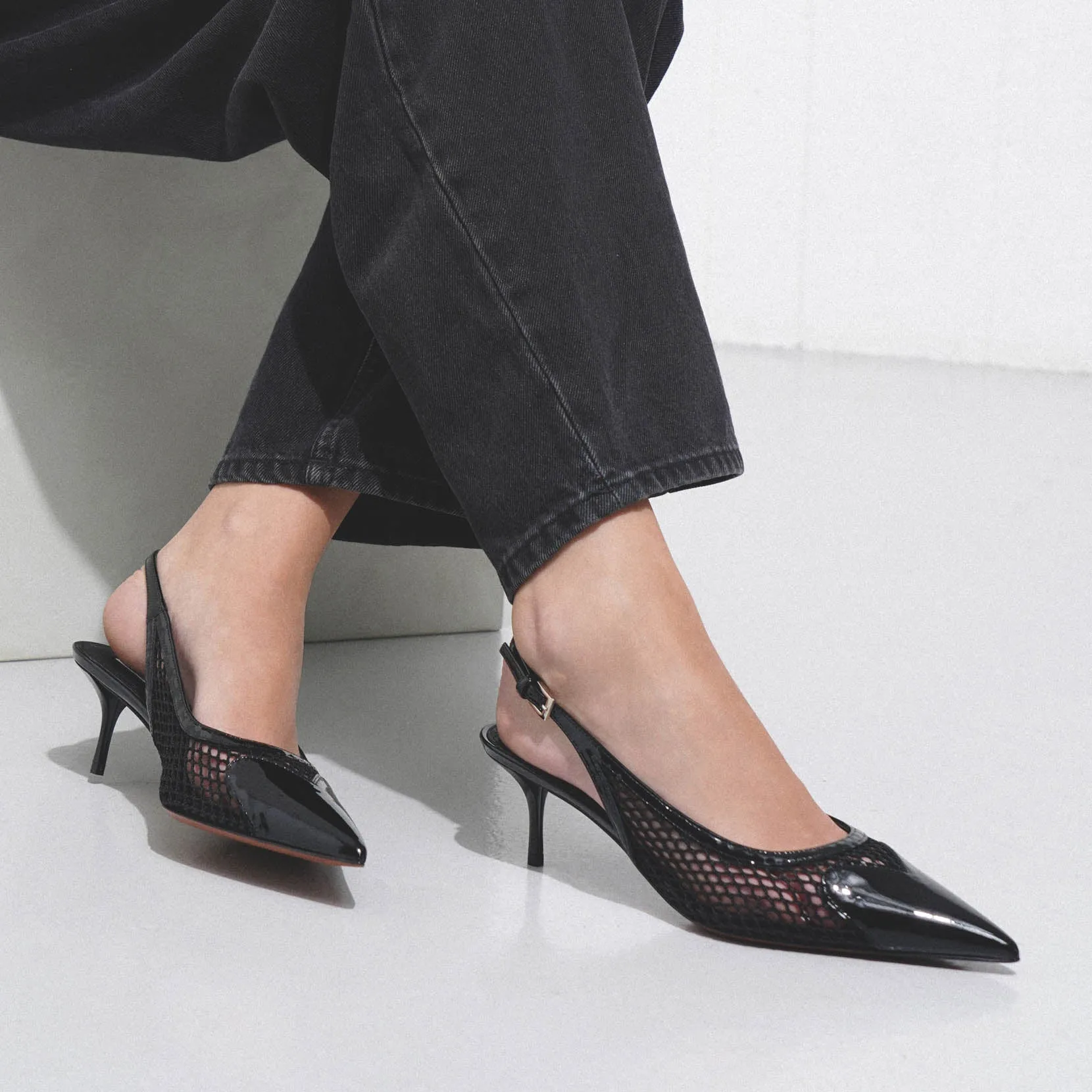 Coeur 55 black patent mesh slingback pumps