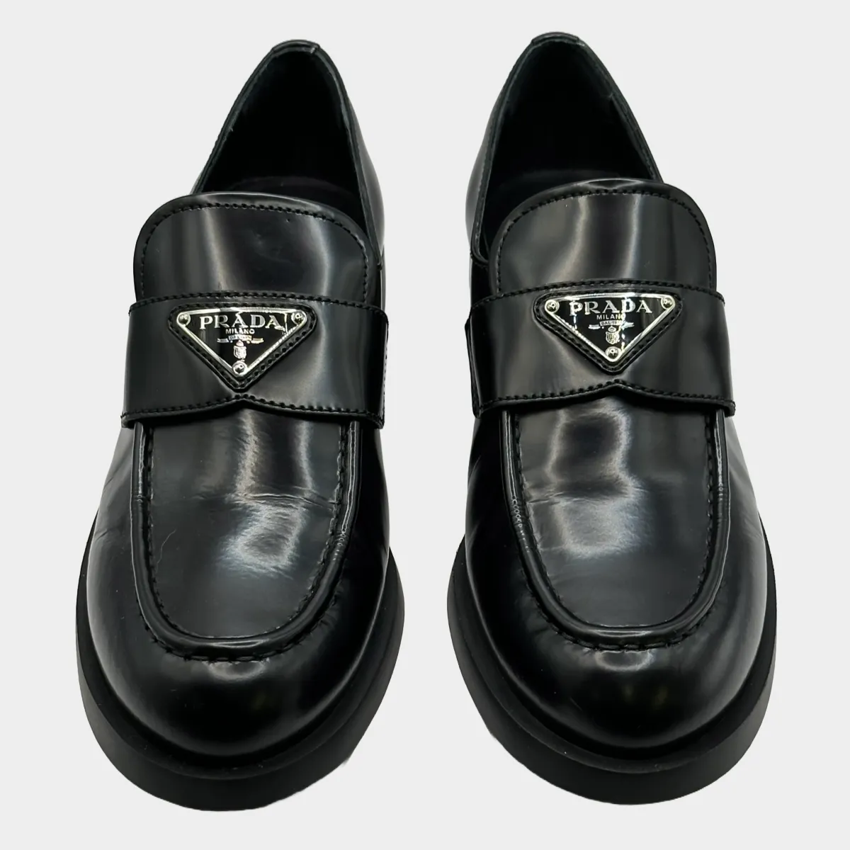 Prada women's black leather logo platform loafers